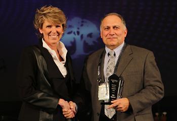 people accepting an award on stage