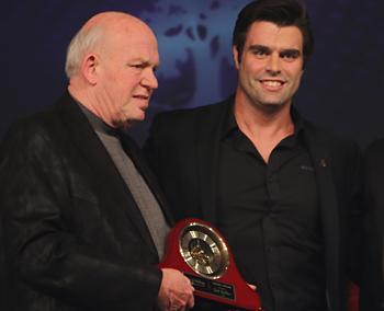 people accepting an award on stage